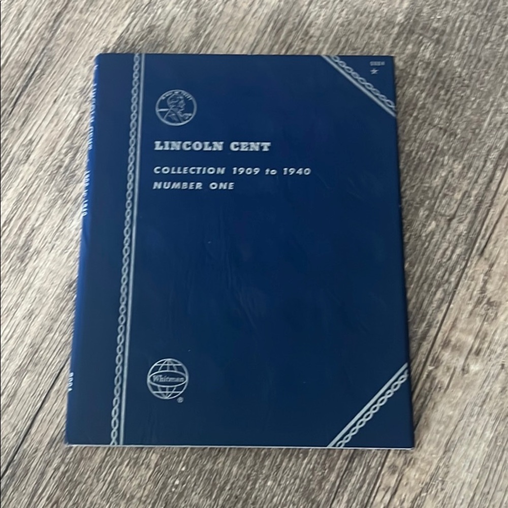 Random assortment of coin collection books (empty)